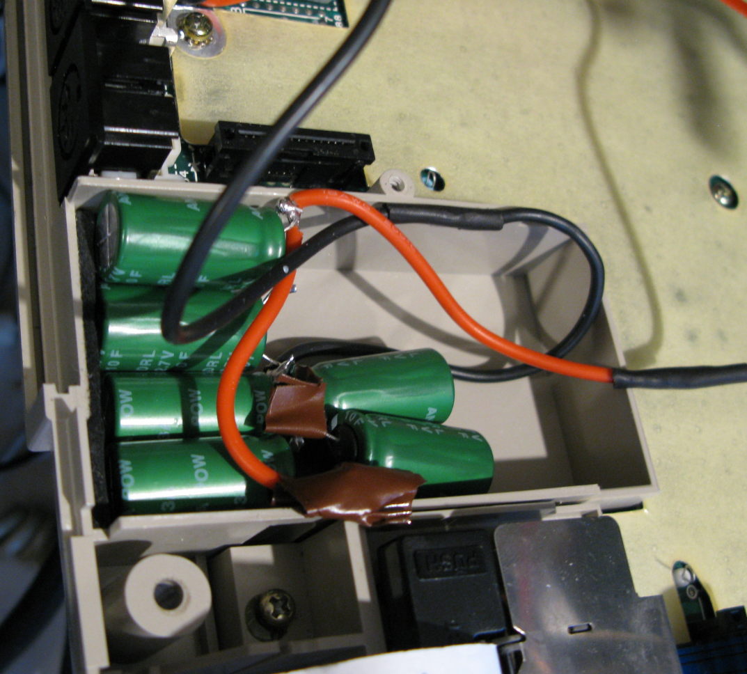 6 super capacitors stuffed into the Epson's battery box inelegantly